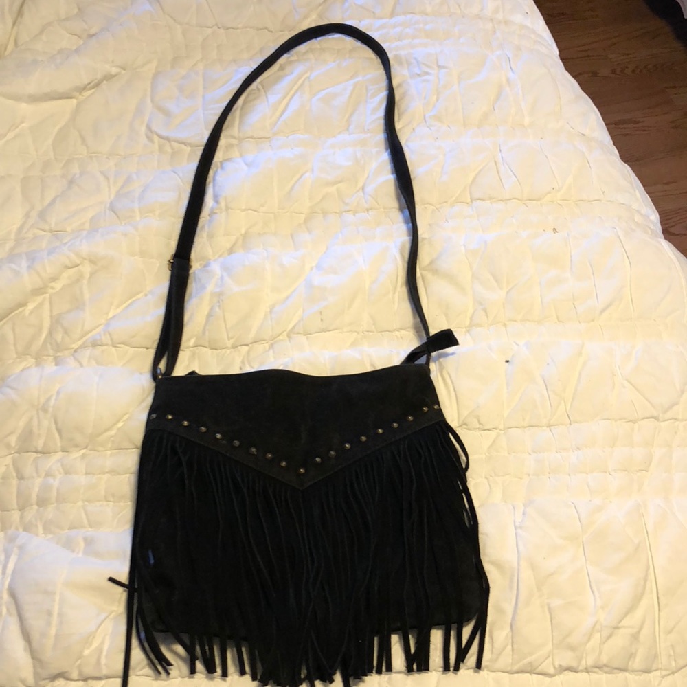 Black cross body bag with bronze studs and fringe